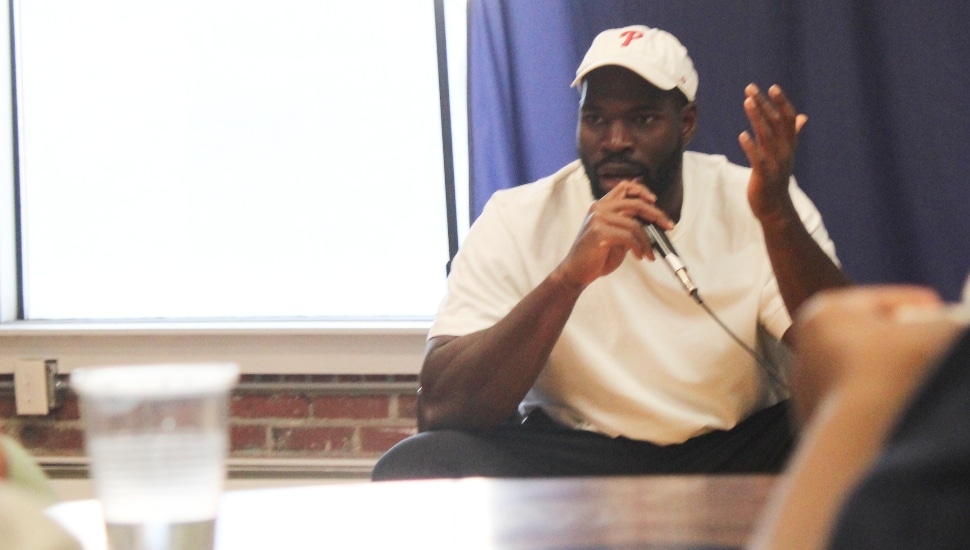 Moro Ojomo speaks during an immigrant storytelling event in Philadelphia.