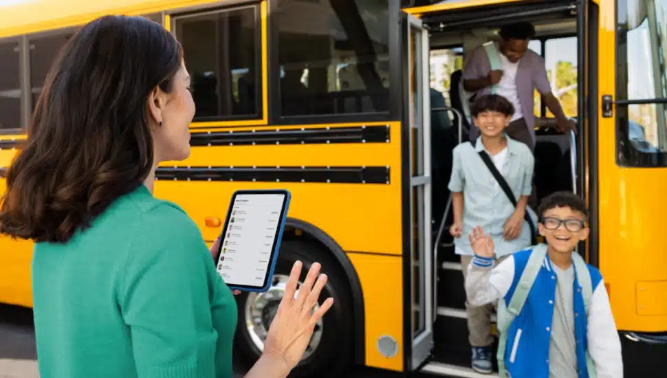 Parent using app for child coming off the school bus.