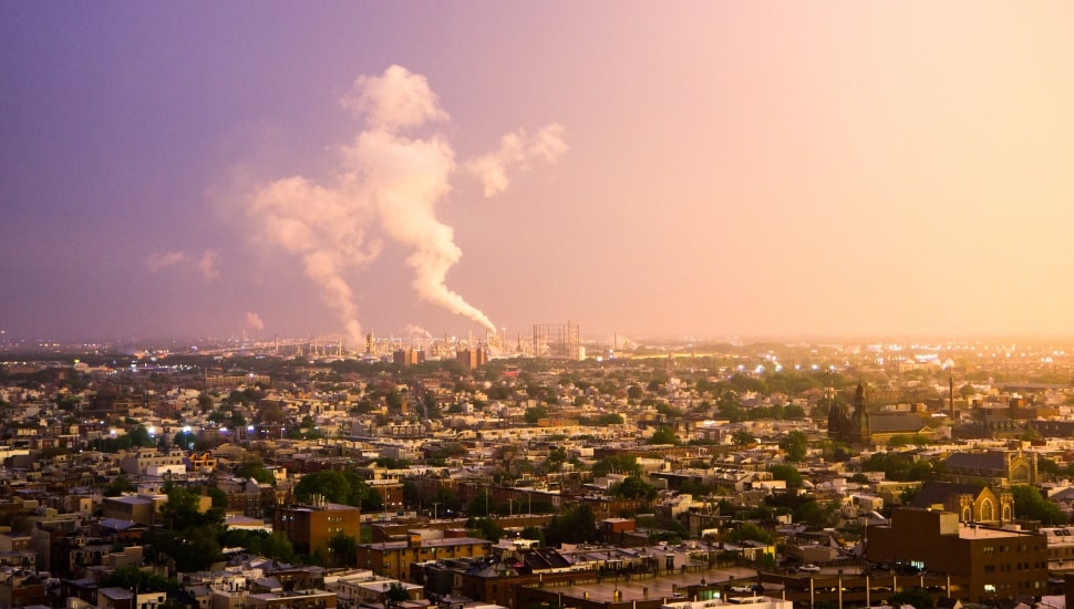 Oil refineries in South Philly give off smoke after a strong summer storm.
